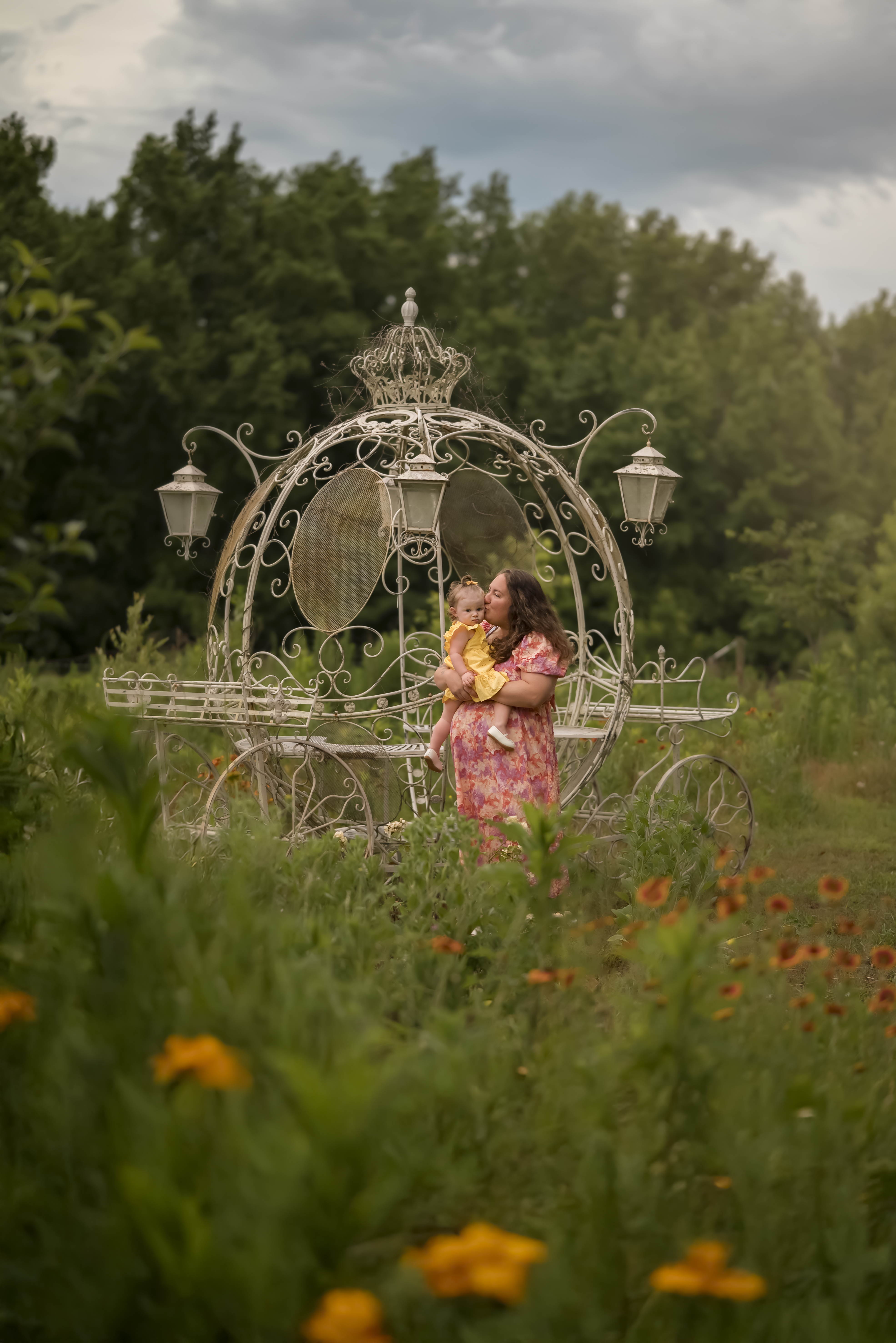 mother daughter portrait in the garden with the princess carriage at monarch ranch butterfly conservatory